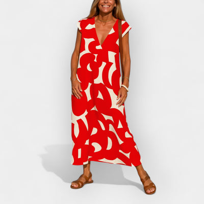 Airy dress with a V-shaped neckline and a modern pattern