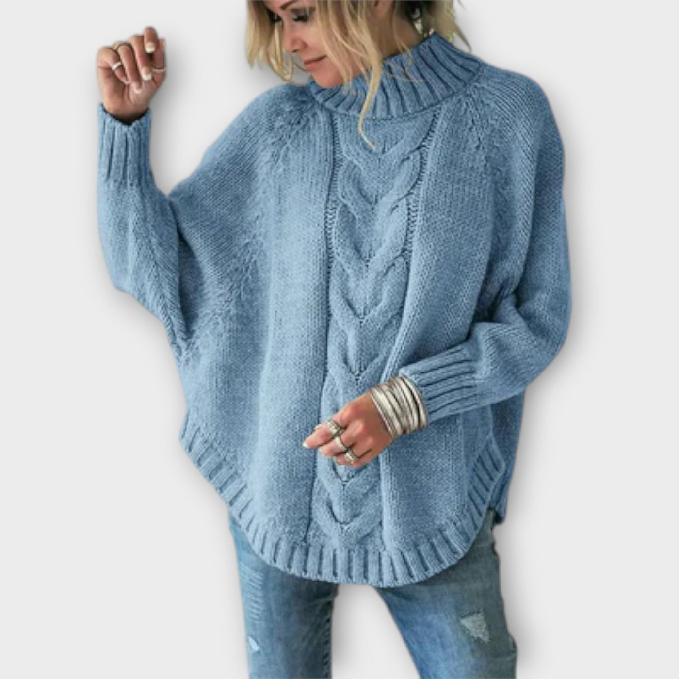 Knitted sweater with cable pattern