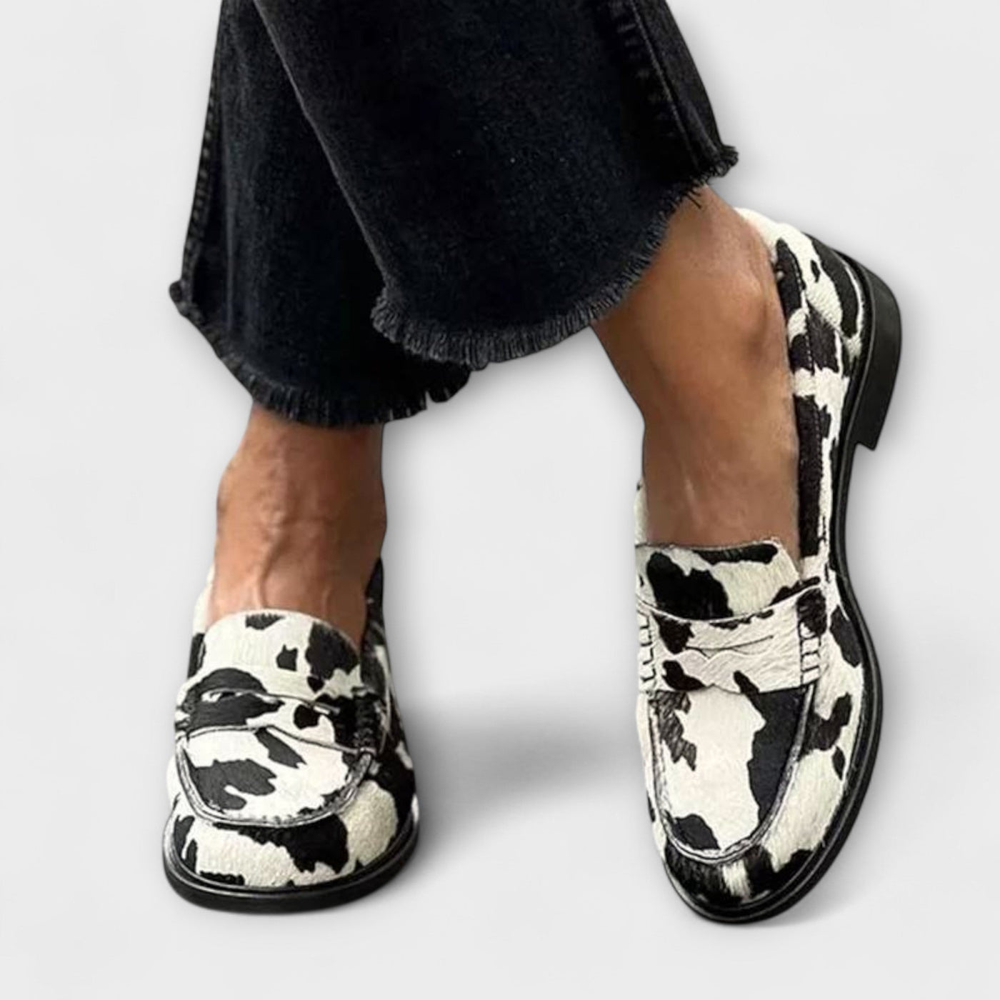 Cow print loafer flats