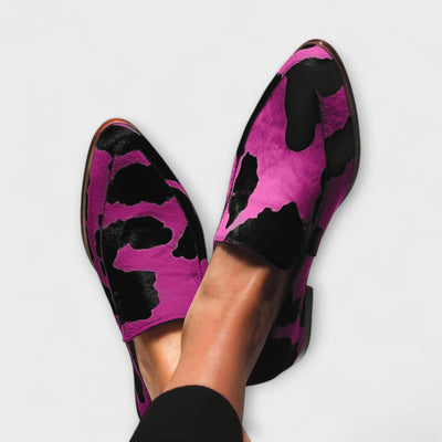 Cow print pointed-toe loafers