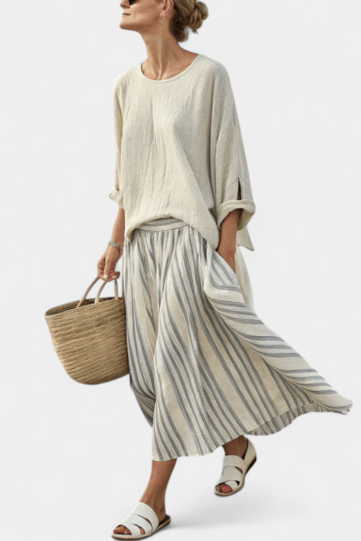 Casual linen set with an oversized blouse and striped midi skirt