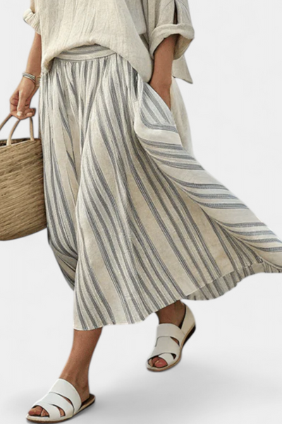 Casual linen set with an oversized blouse and striped midi skirt