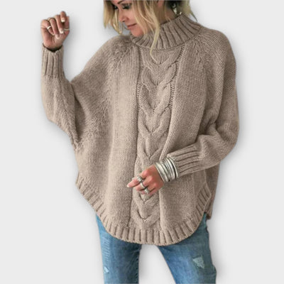 Knitted sweater with cable pattern