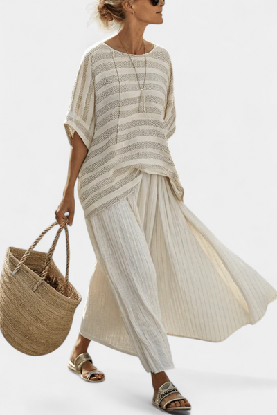 Linen set with a stylish striped blouse and flared trousers