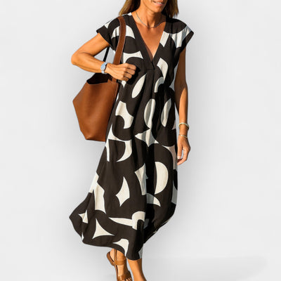 Airy dress with a V-shaped neckline and a modern pattern