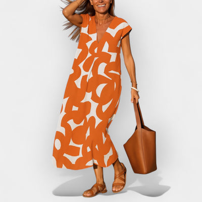 Airy dress with a V-shaped neckline and a modern pattern