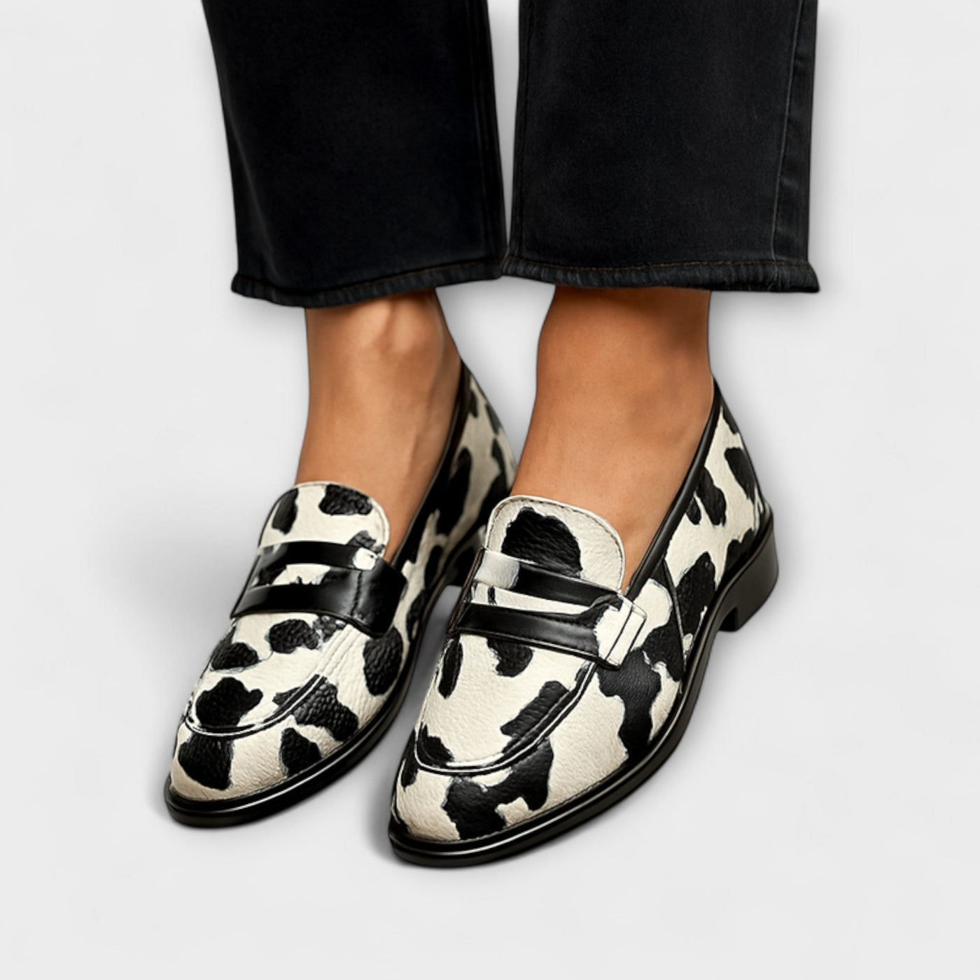 Cow print loafer flats