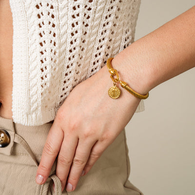 Golden bracelet with Saint Benedict charm