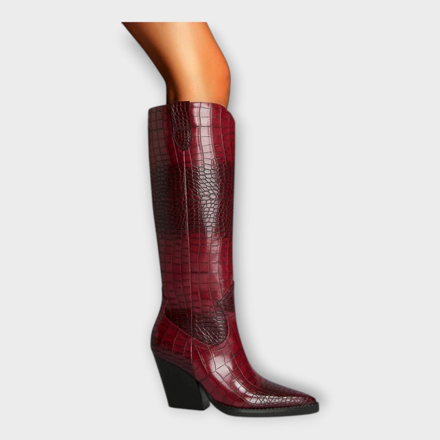 Knee-height leather boots with crocodile pattern