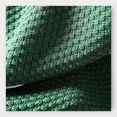 Knitted sweater with high collar