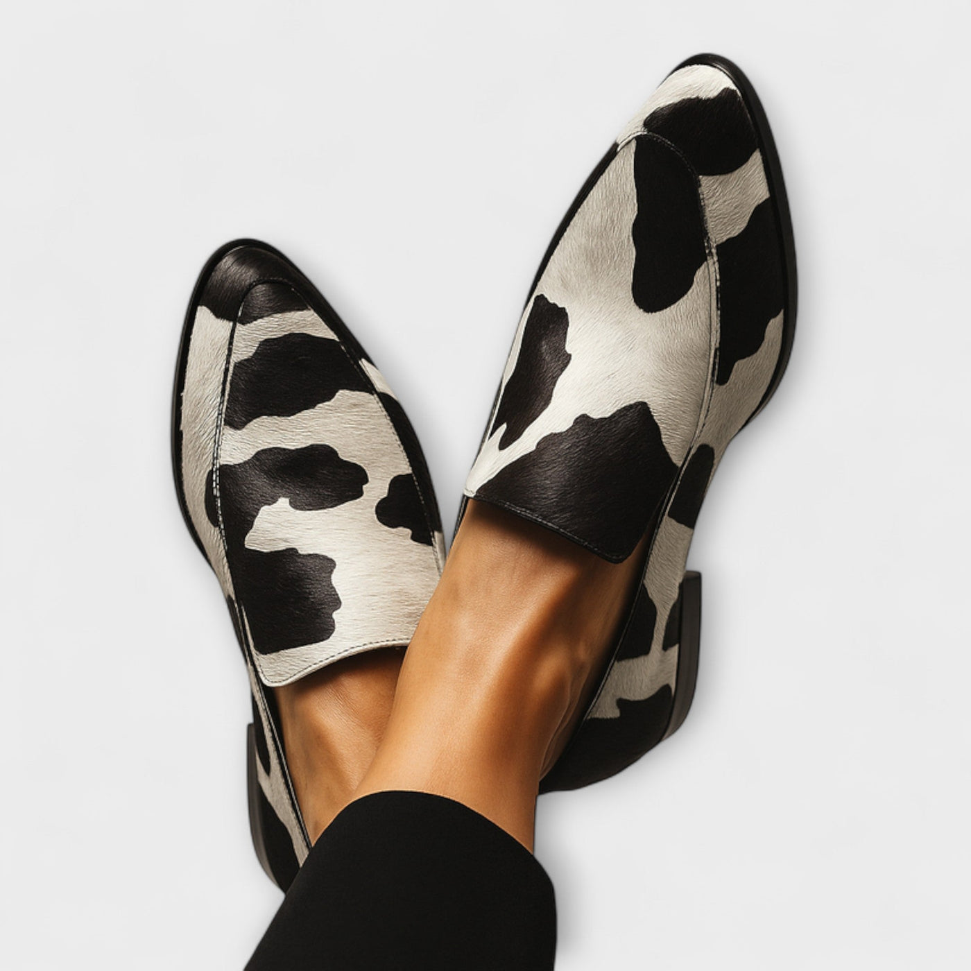 Bold cow print loafers