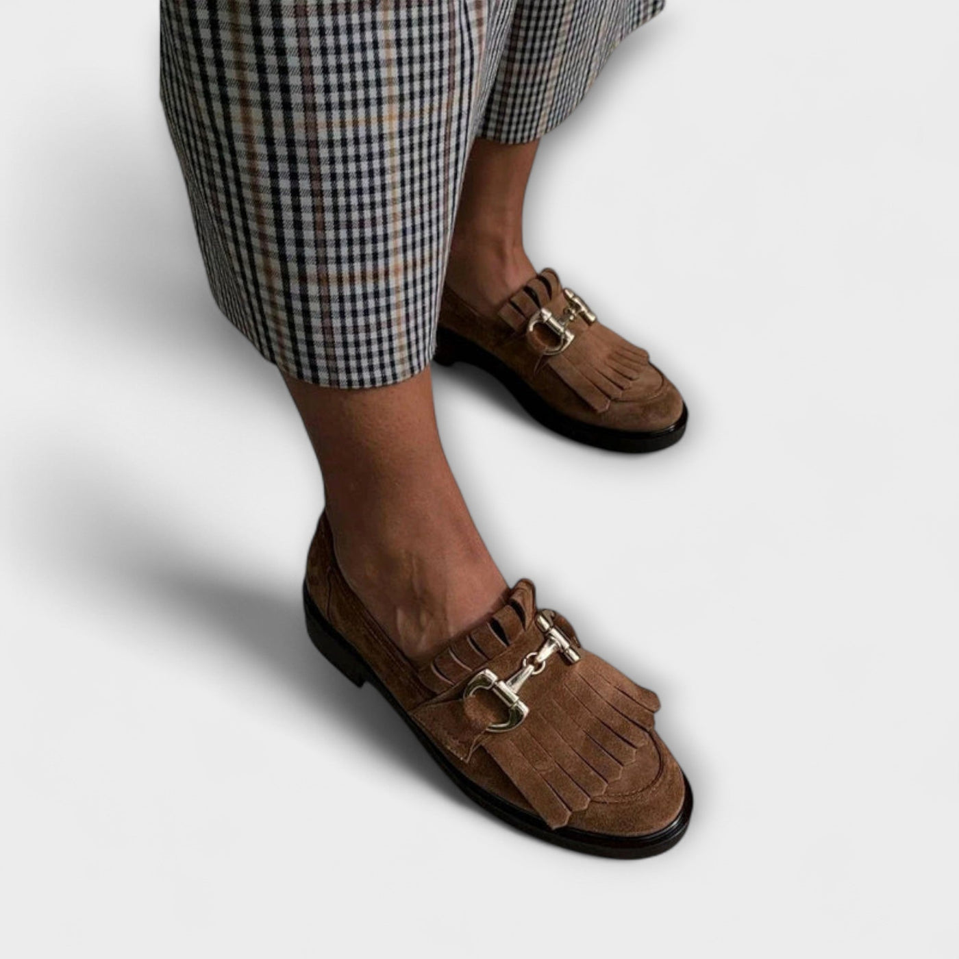 Traditional brown moccasins with a round toe