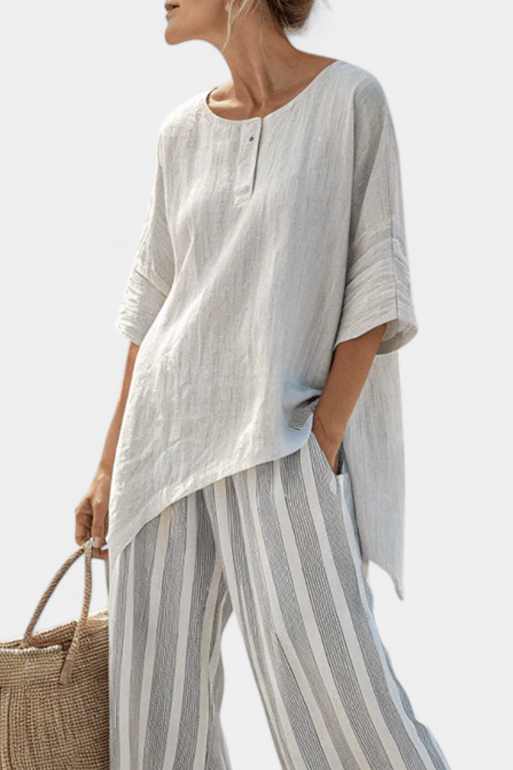 Set with an asymmetrical blouse and striped trousers