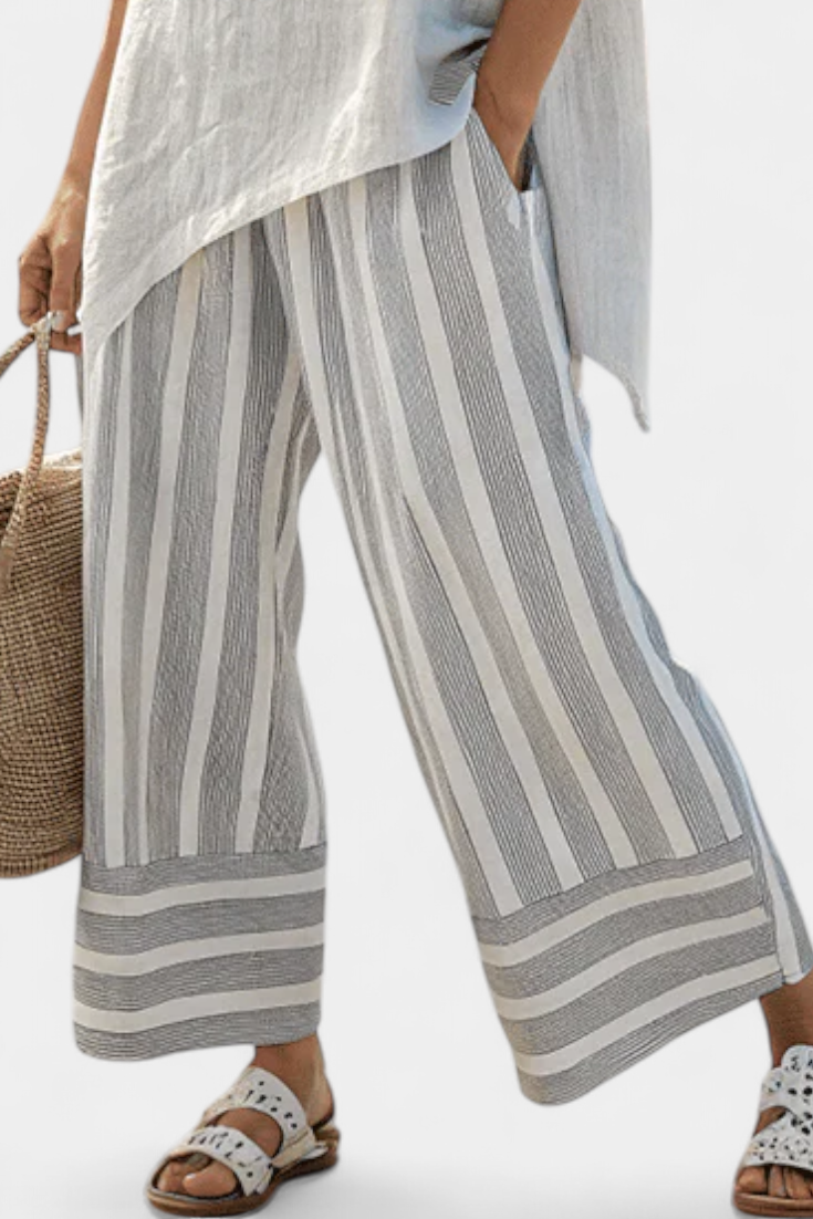Set with an asymmetrical blouse and striped trousers