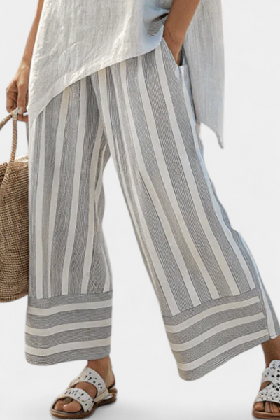 Set with an asymmetrical blouse and striped trousers