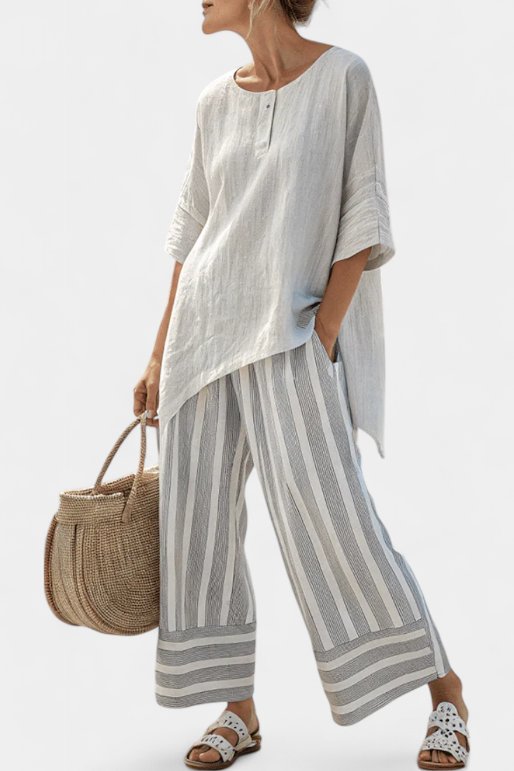 Set with an asymmetrical blouse and striped trousers
