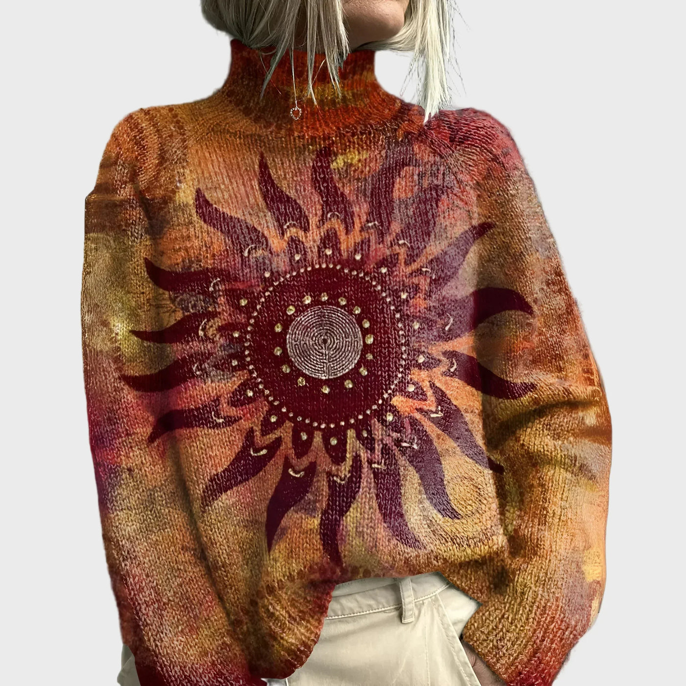Knitted turtleneck sweater with sun and tribal pattern